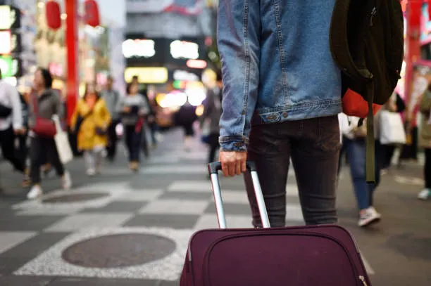 Tourists Dragging Heavy Suitcases Across&hellip;